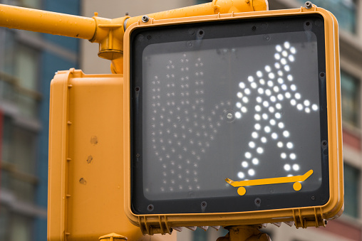 Skateboarder pedestrian light